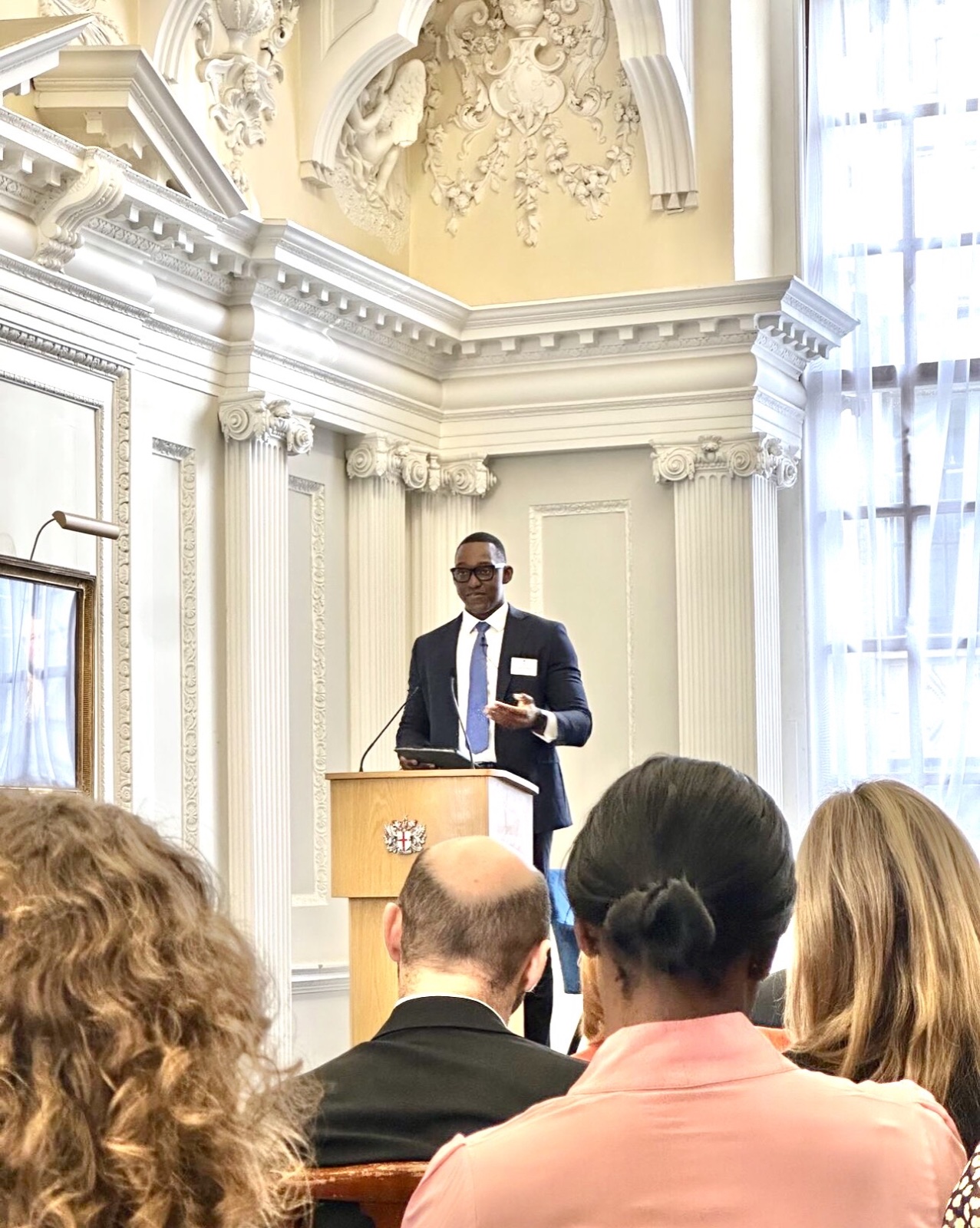 Kwaku Kyei-Manu addressing an audience at Mansion House.